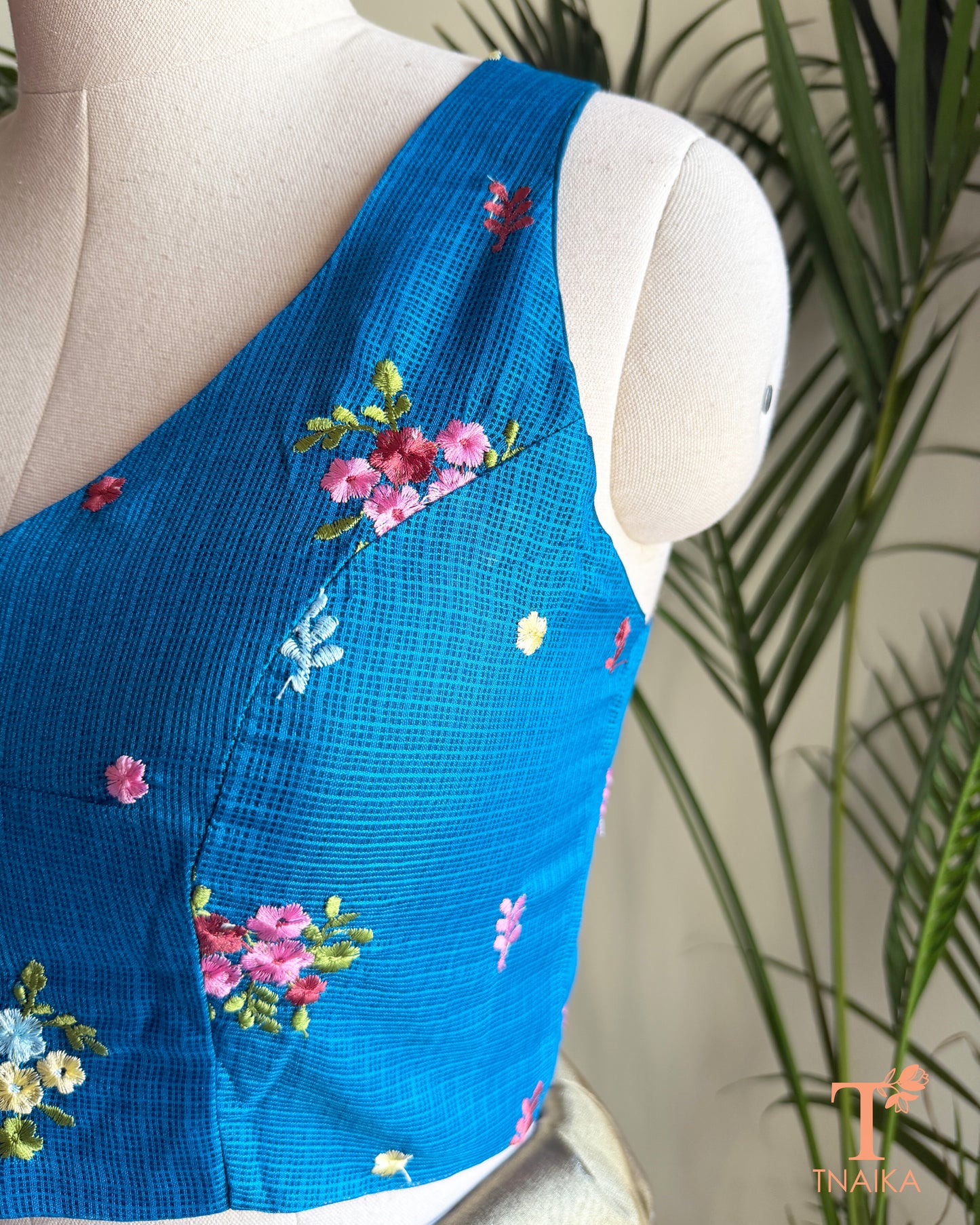Side view of premium Kota silk saree blouse with intricate floral embroidery and structured silhouette.
