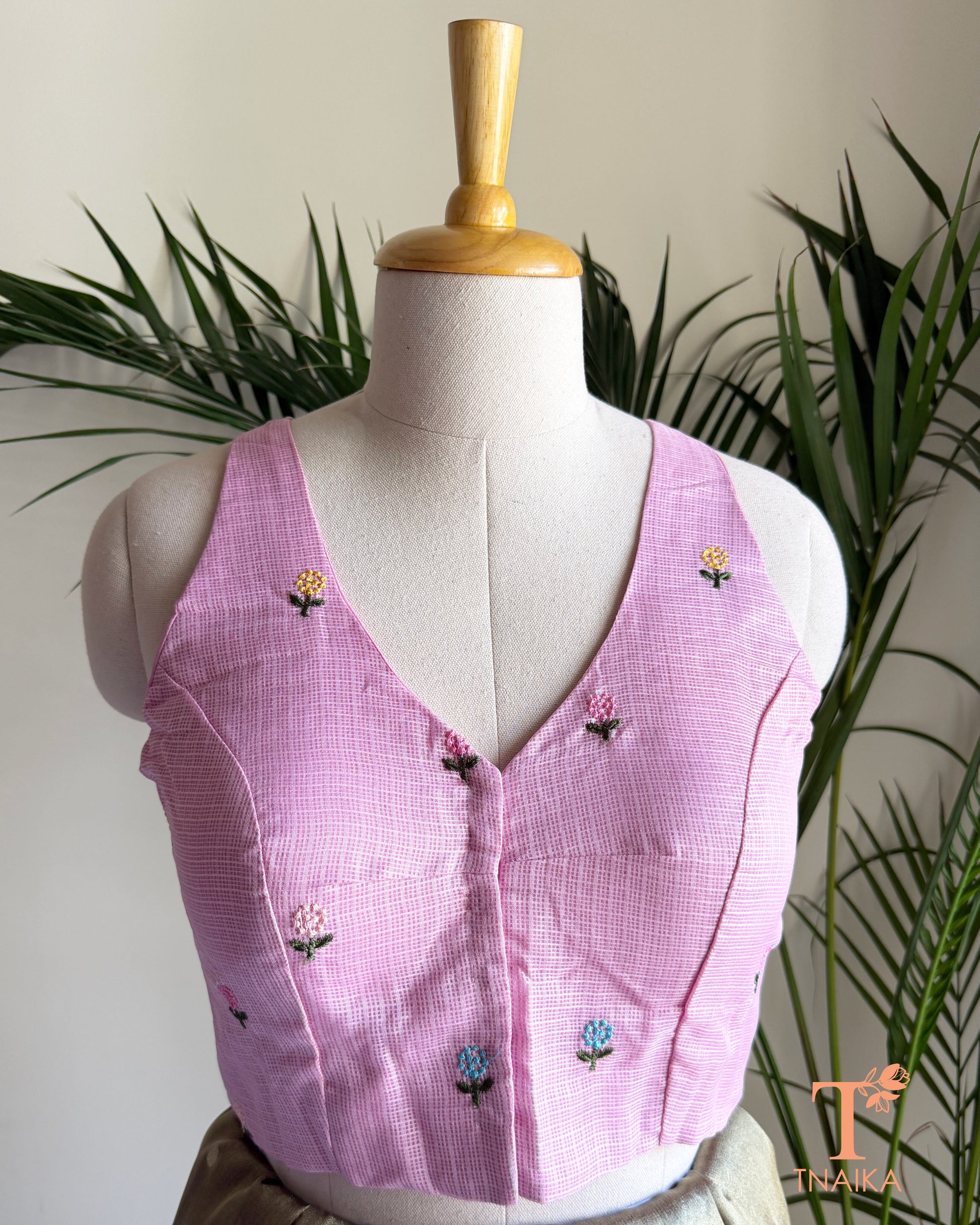 Front view of embroidered Kota silk blouse featuring floral motifs and a flattering V-neck design.