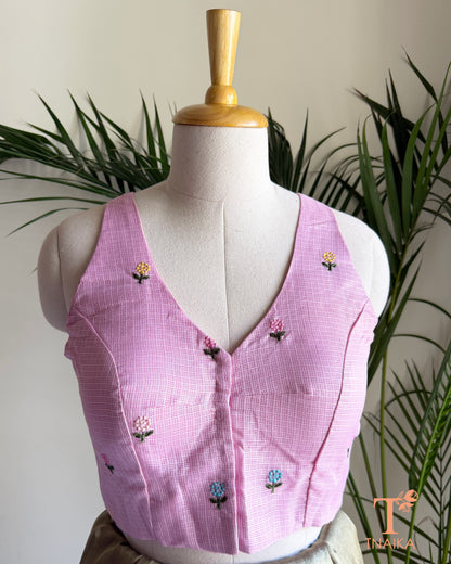 Front view of embroidered Kota silk blouse featuring floral motifs and a flattering V-neck design.