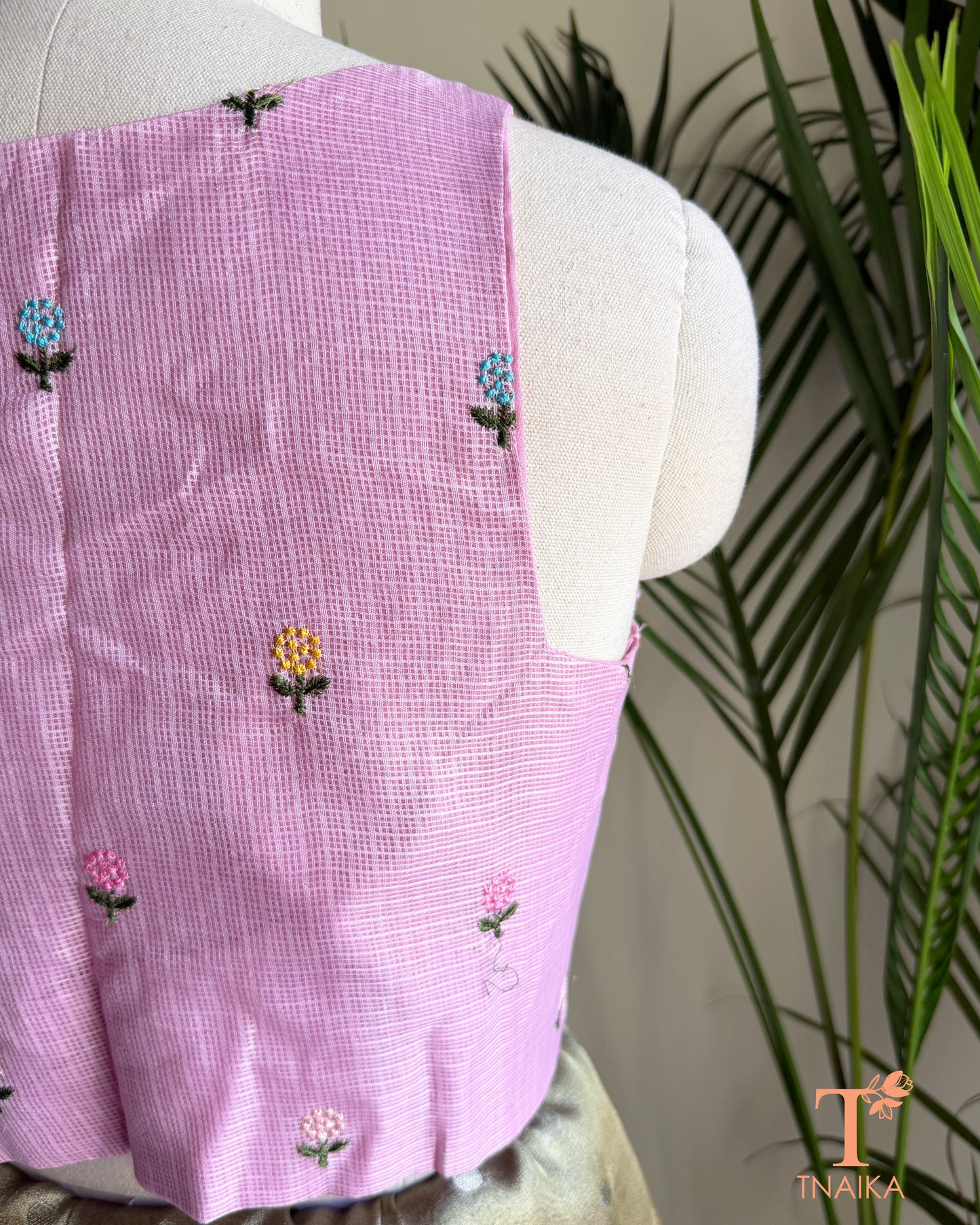 Close-up of floral embroidery detailing on premium Kota silk blouse showcasing handcrafted artistry.