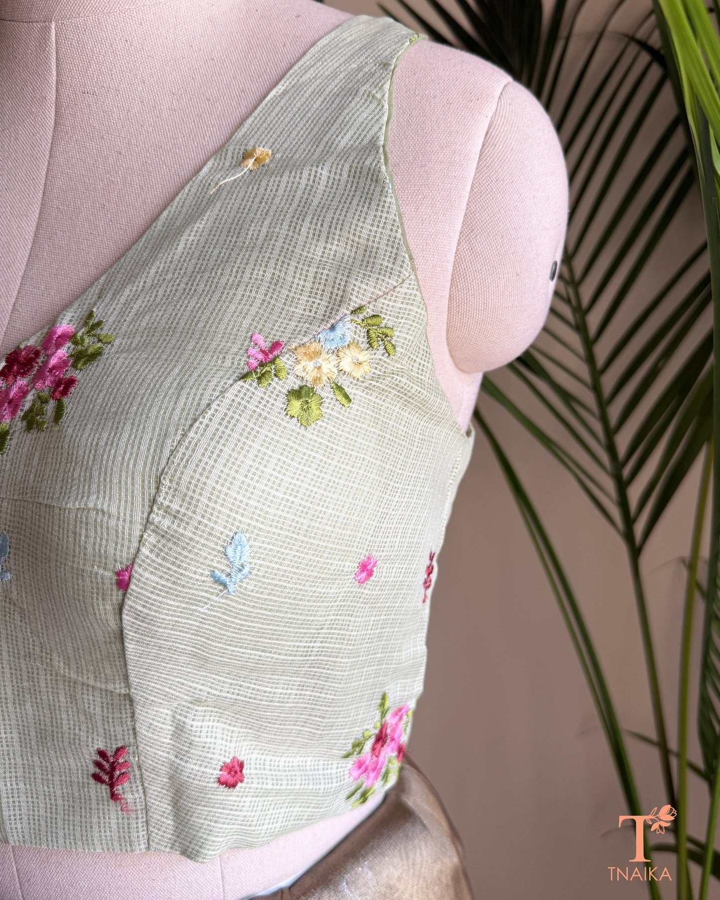 Designer Kota silk blouse with multicolour floral embroidery and elegant high-back silhouette for festive saree styling.