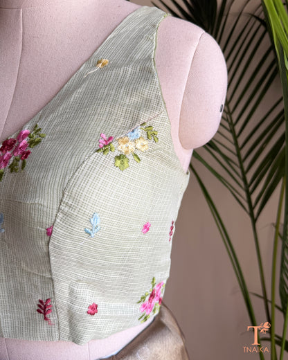 Designer Kota silk blouse with multicolour floral embroidery and elegant high-back silhouette for festive saree styling.
