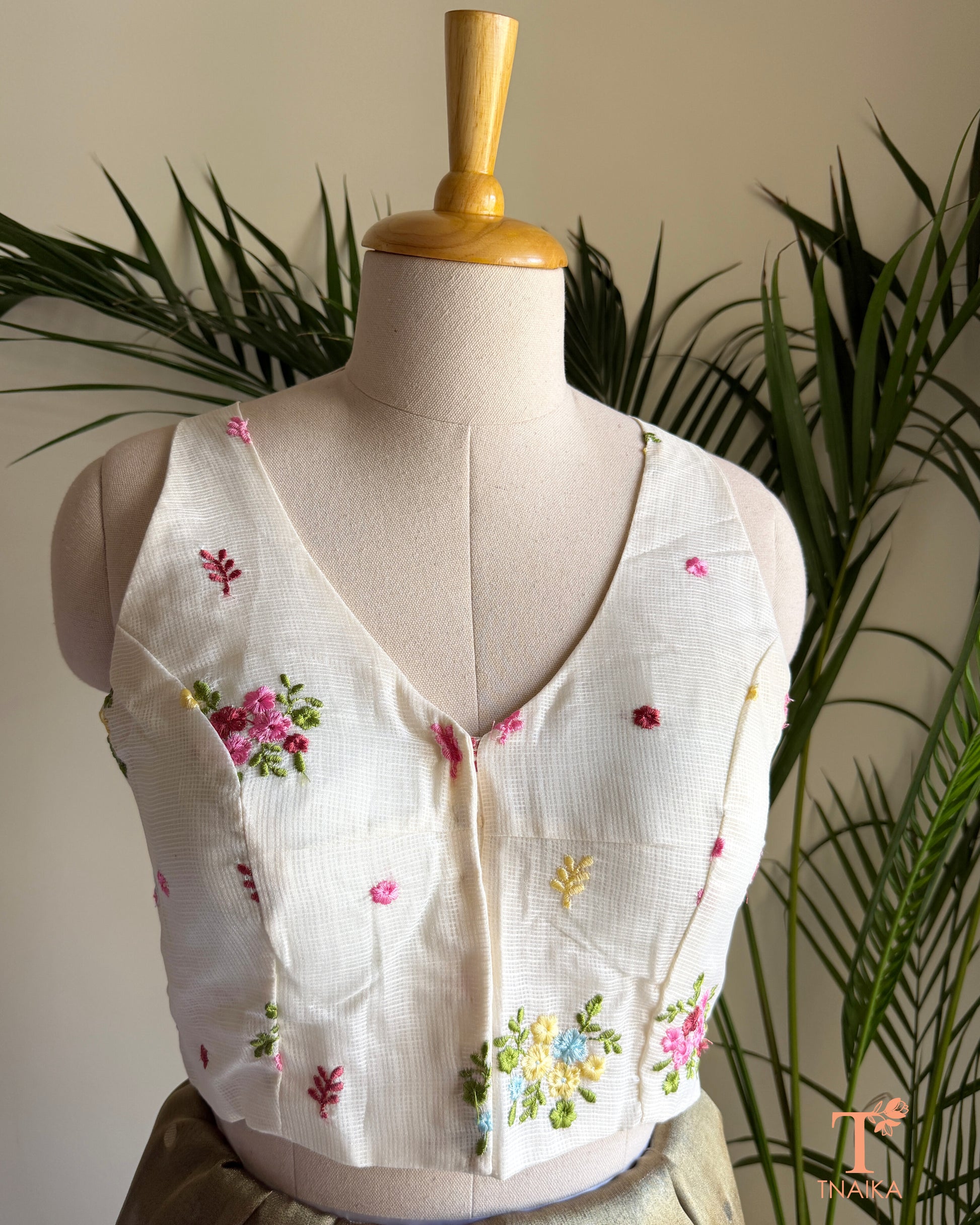 Front view of embroidered Kota silk blouse featuring a flattering V-neckline and intricate floral embroidery detailing.