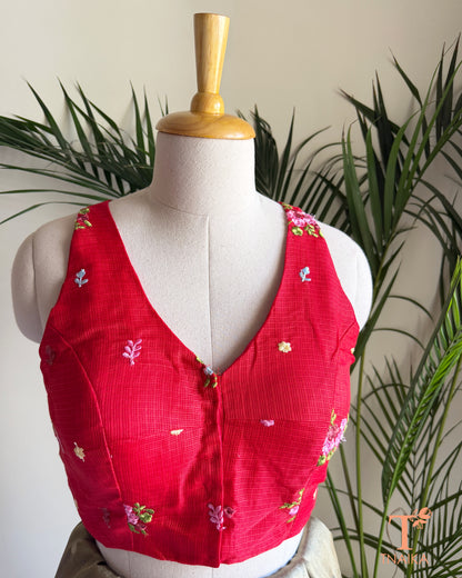 Front view of embroidered Kota silk blouse featuring floral motifs and a flattering V-neck design.