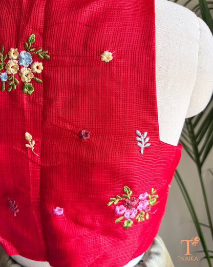 Close-up of floral embroidery detailing on premium Kota silk blouse showcasing handcrafted artistry.