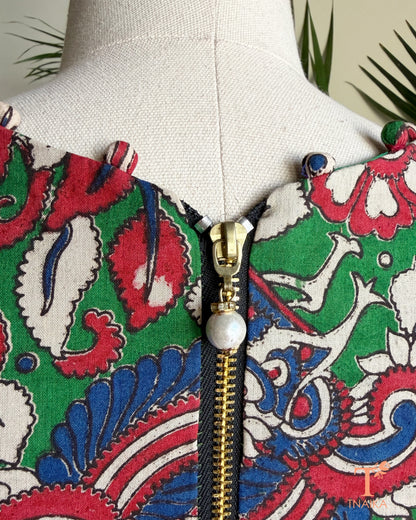 Back view of Tnaika™ Kalamkari cotton blouse showcasing an antique-finish zipper closure and all-over Kalamkari-inspired floral and peacock print.