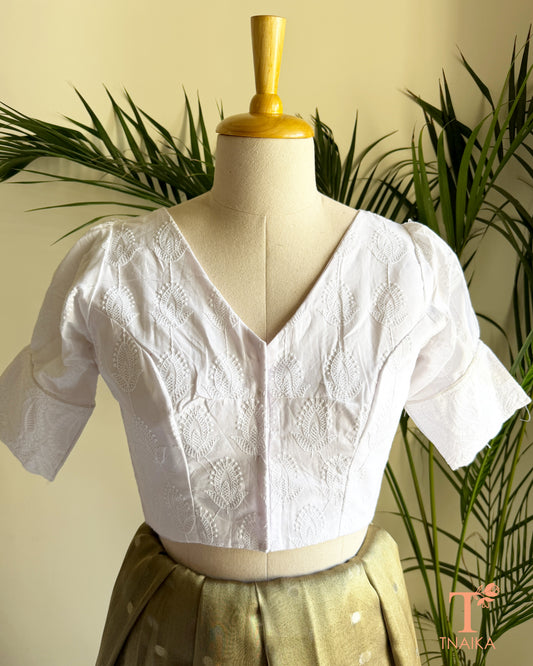 White Chikankari inspired cotton blouse with V-neck and puff sleeves front view.