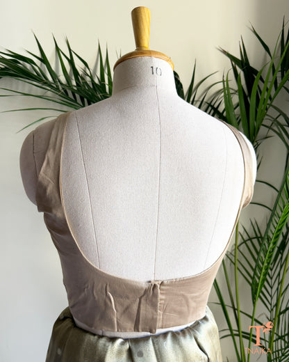 Back view of premium blouse featuring a deep U-shaped back and concealed hook closure.