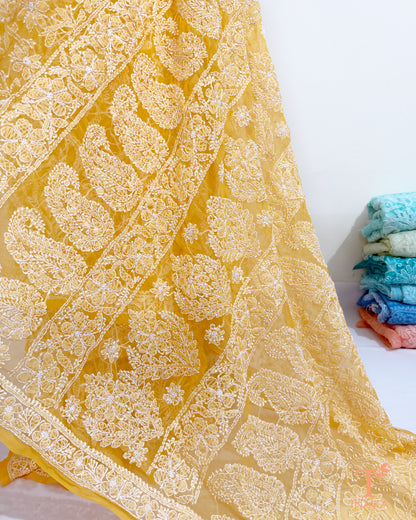 Elegant yellow Chikankari saree featuring detailed embroidered pallu.