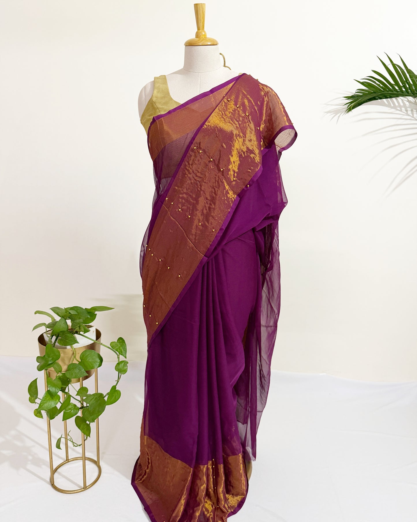Lightweight chiffon saree with sheer pallu and tissue border.