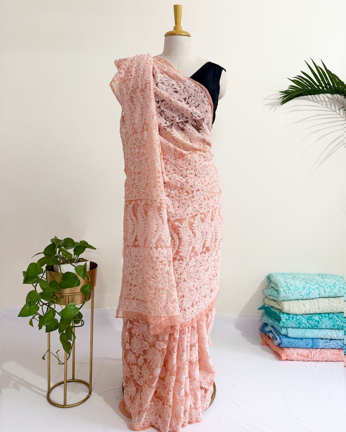 Blush peach Chikankari saree with intricate full jaal floral embroidery and elegant handcrafted detailing.