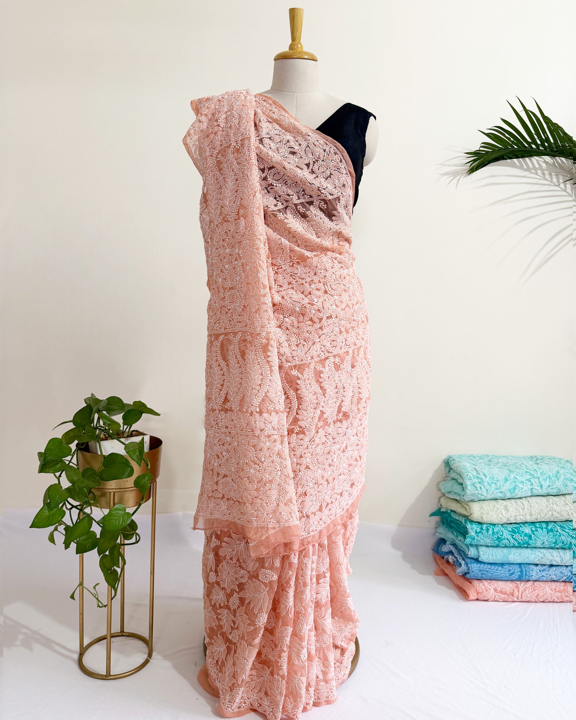 Blush peach Chikankari saree with intricate full jaal floral embroidery and elegant handcrafted detailing.