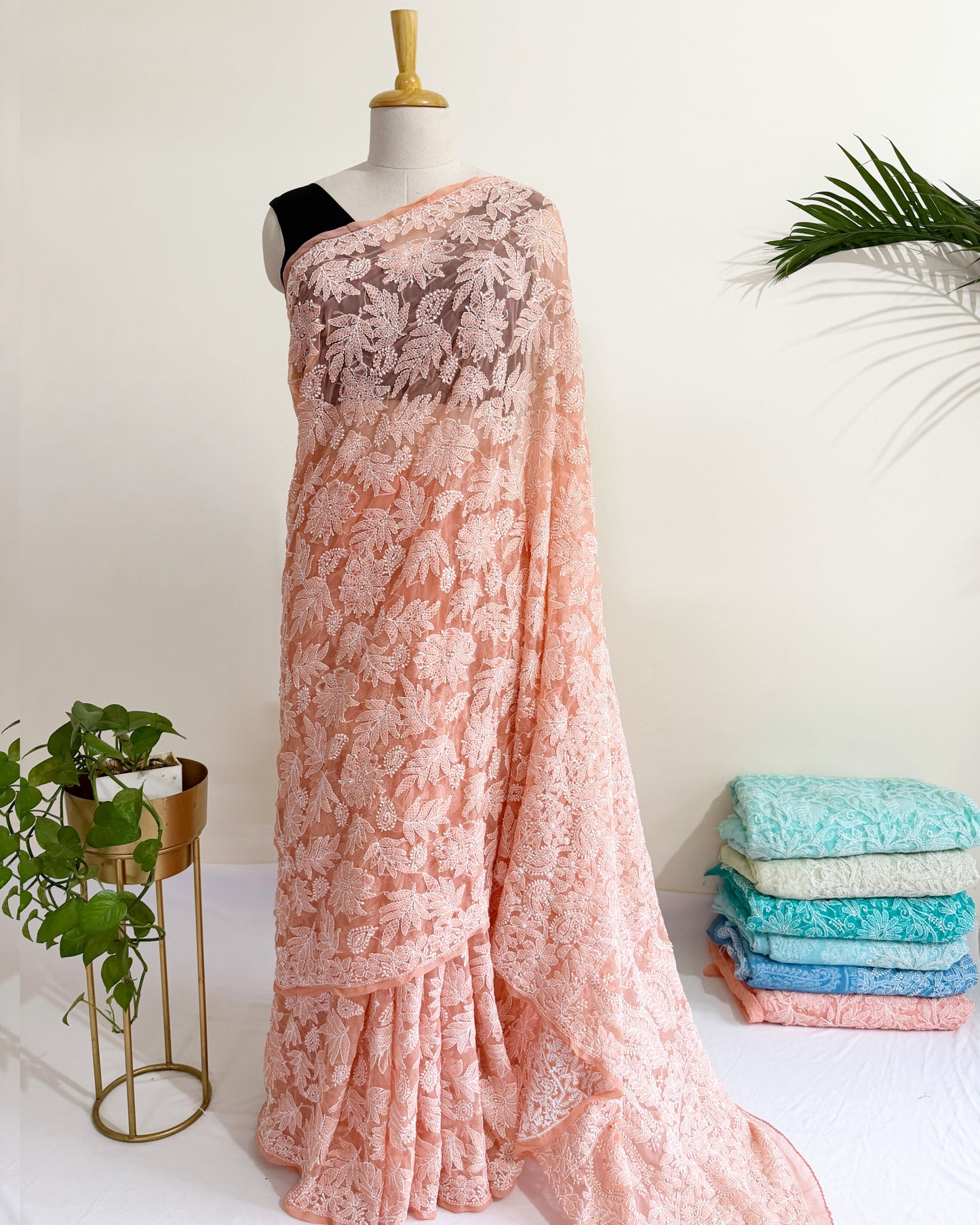 Blush peach Chikankari saree with intricate full jaal floral embroidery and elegant handcrafted detailing.