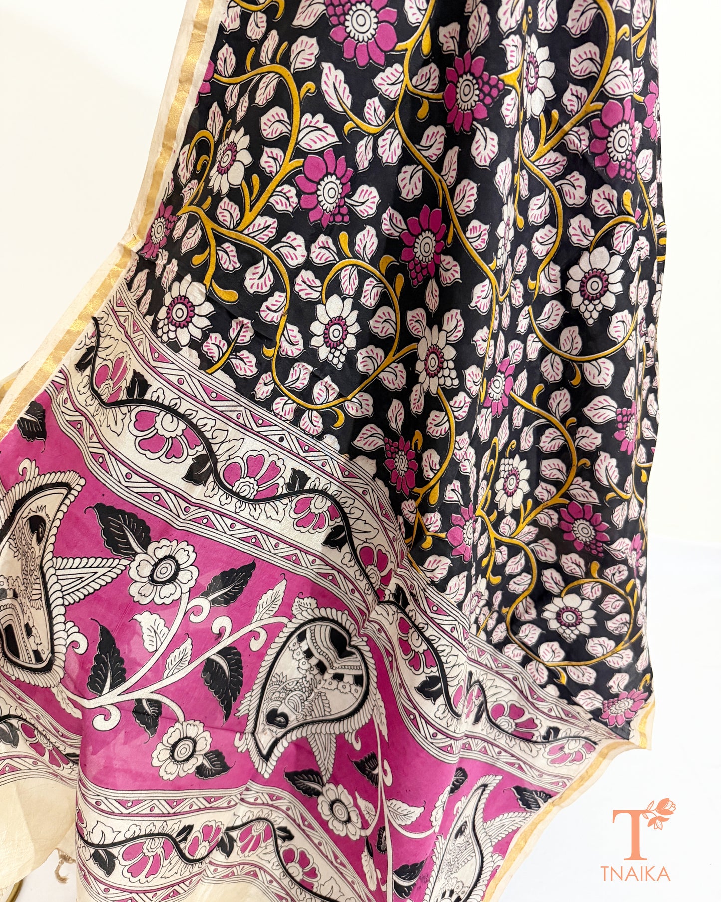 Premium Nellore silk blend hand block Kalamkari dupatta featuring traditional artisan prints, fine zari border and tassel finish.