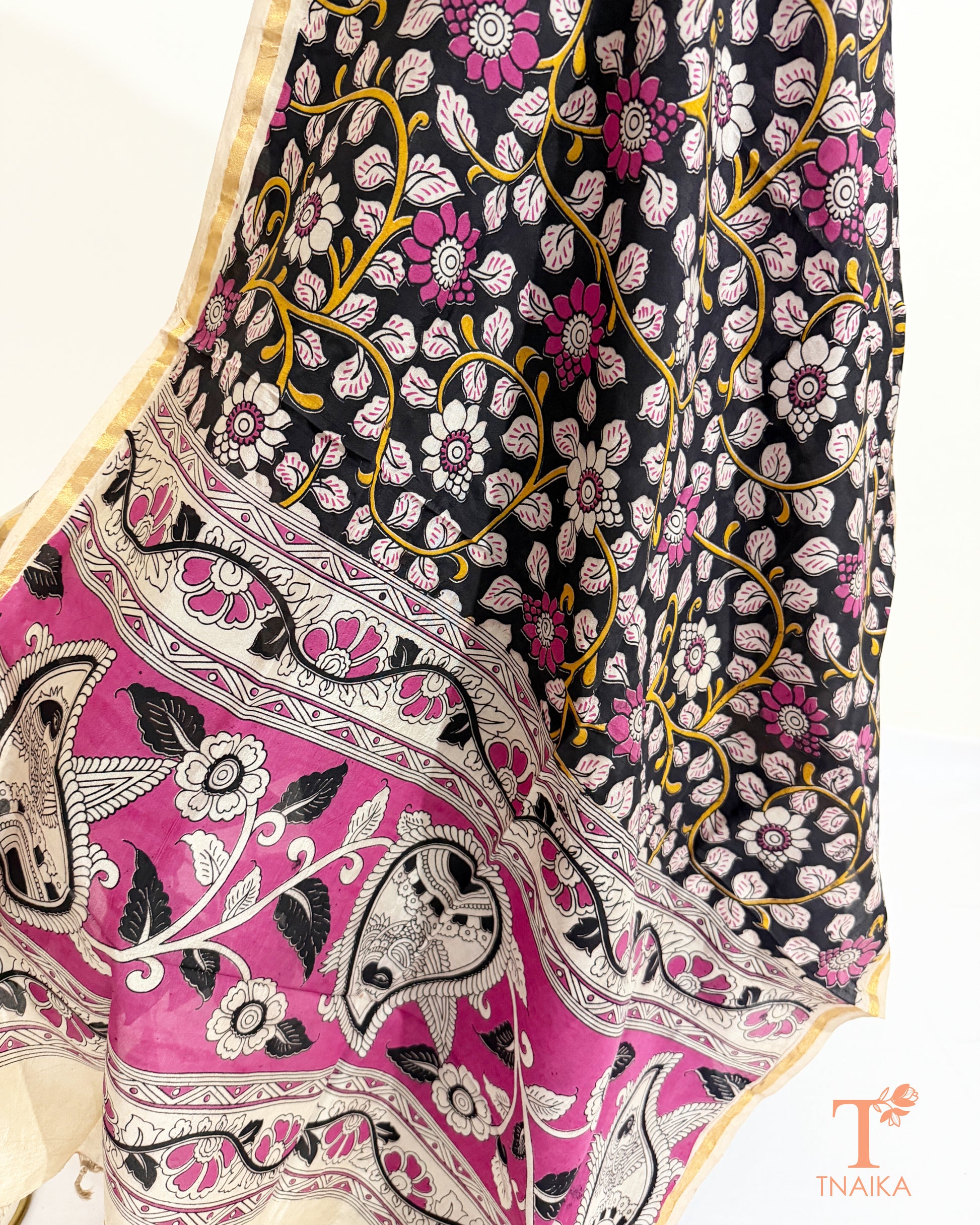 Premium Nellore silk blend hand block Kalamkari dupatta featuring traditional artisan prints, fine zari border and tassel finish.