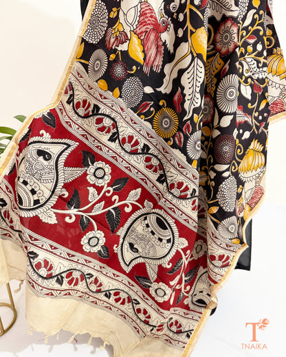 Premium Nellore silk blend hand block Kalamkari dupatta featuring traditional artisan prints, fine zari border and tassel finish.