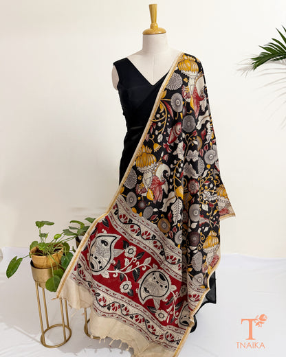 Hand block Kalamkari Nellore silk blend dupatta with fine zari border, traditional artisan prints and soft tassel detailing.