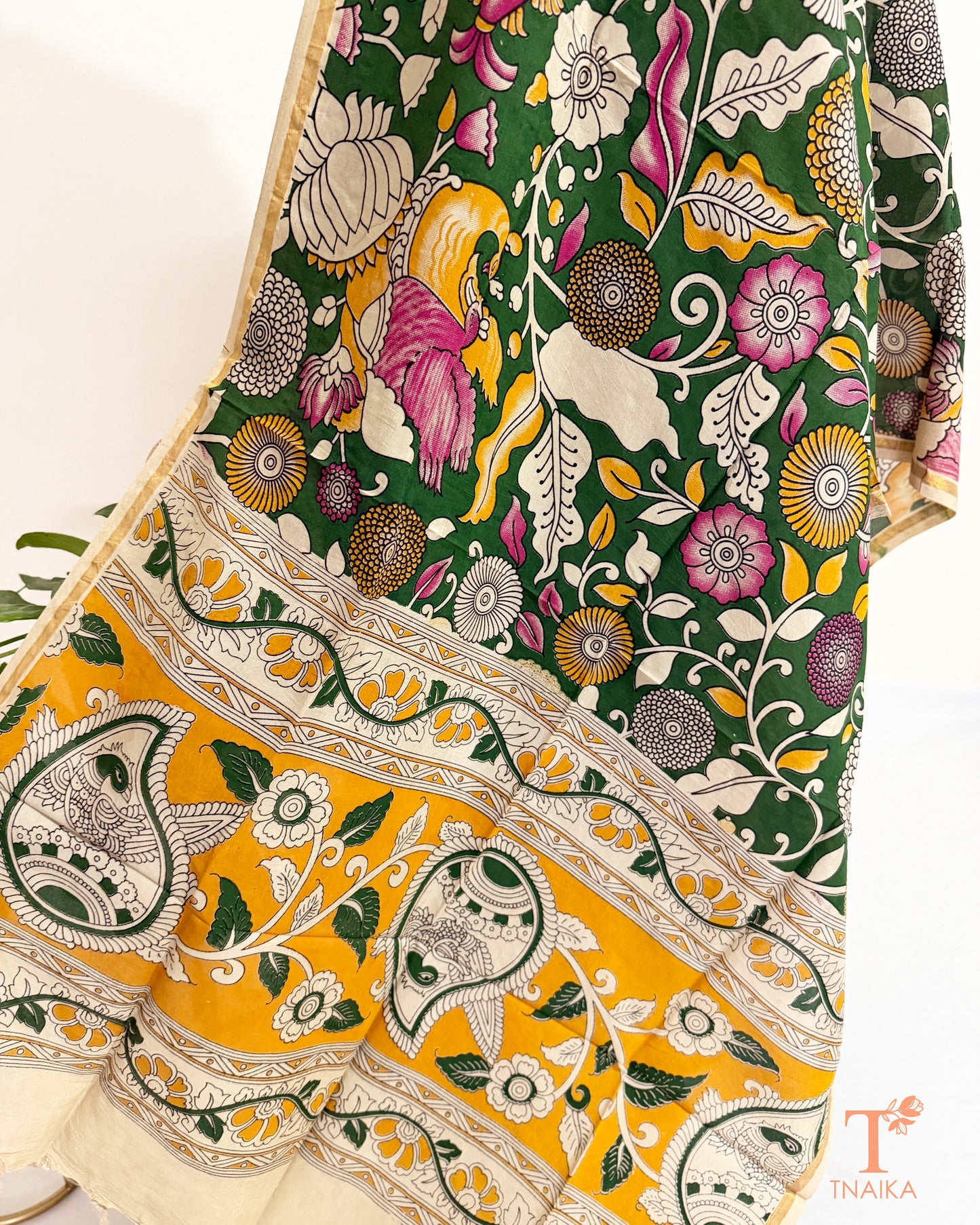 Premium Nellore silk blend hand block Kalamkari dupatta featuring traditional artisan prints, fine zari border and tassel finish.