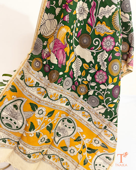 Premium Nellore silk blend hand block Kalamkari dupatta featuring traditional artisan prints, fine zari border and tassel finish.