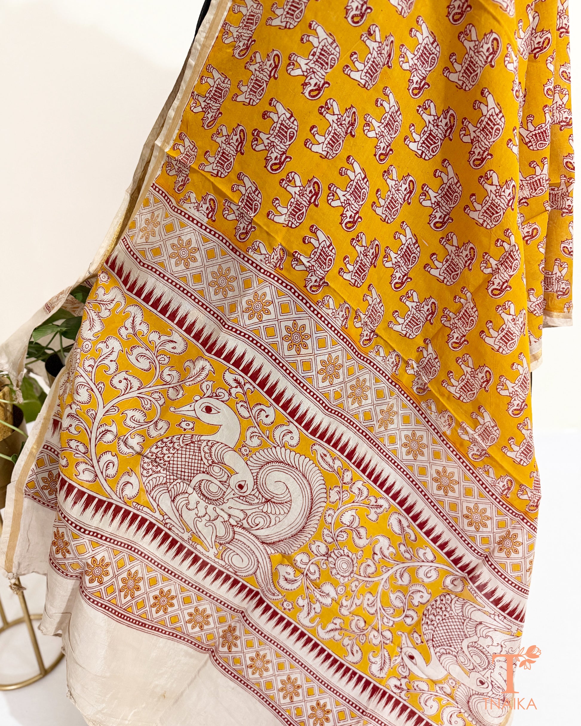 Premium Nellore silk blend hand block Kalamkari dupatta featuring traditional artisan prints, fine zari border and tassel finish.