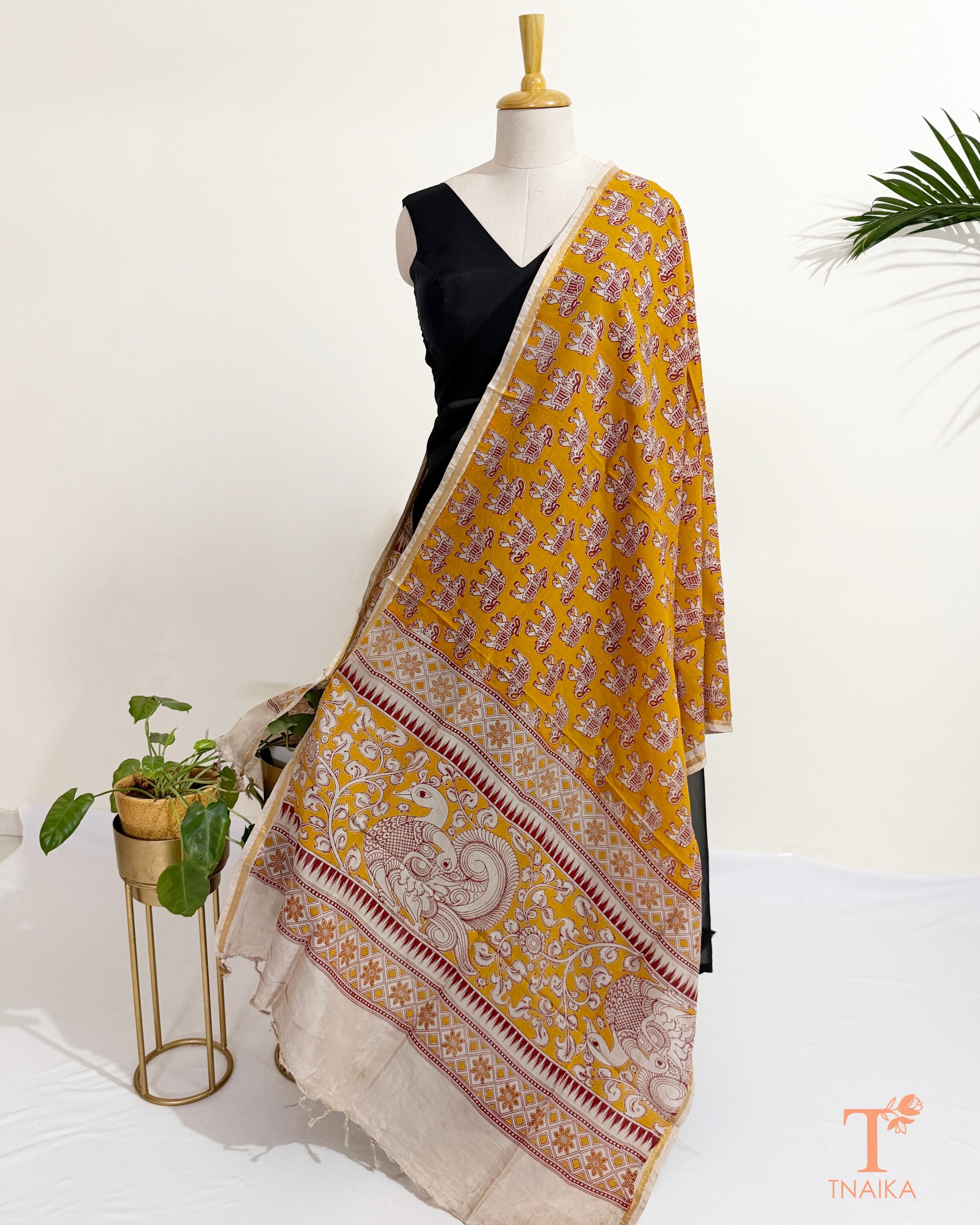 Hand block Kalamkari Nellore silk blend dupatta with fine zari border, traditional artisan prints and soft tassel detailing.