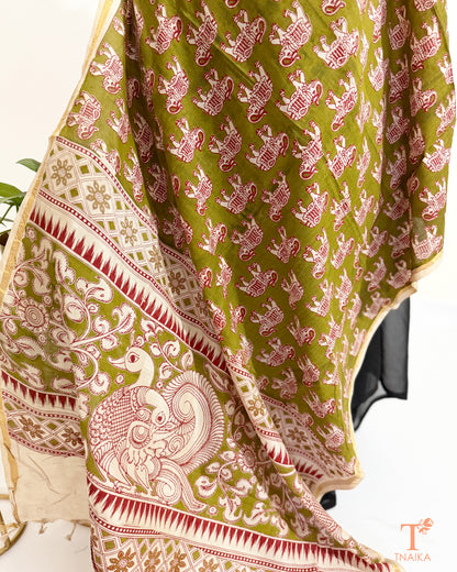 Premium Nellore silk blend hand block Kalamkari dupatta featuring traditional artisan prints, fine zari border and tassel finish.