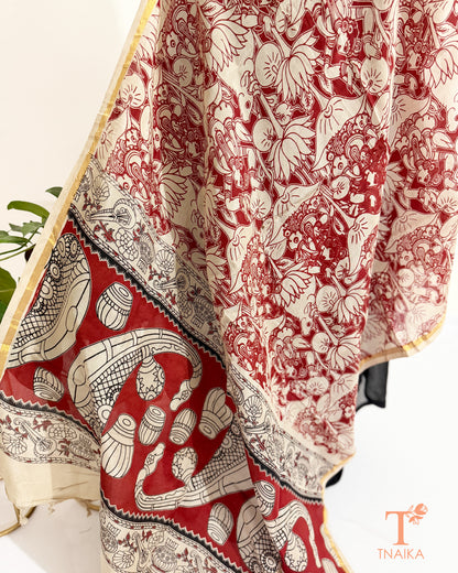 Premium Nellore silk blend hand block Kalamkari dupatta featuring traditional artisan prints, fine zari border and tassel finish.