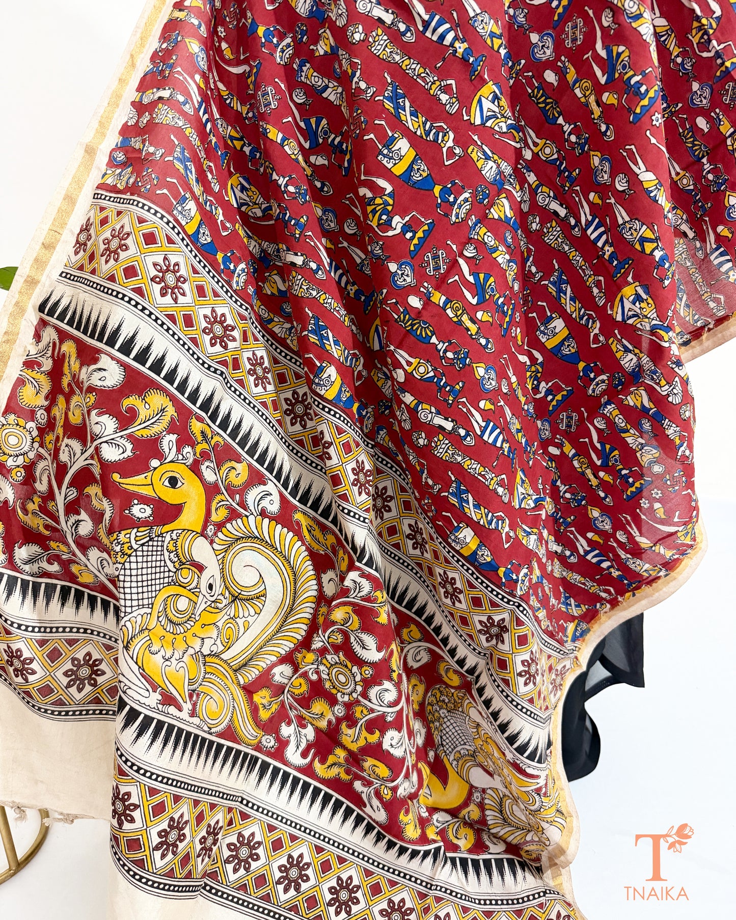 Premium Nellore silk blend hand block Kalamkari dupatta featuring traditional artisan prints, fine zari border and tassel finish.