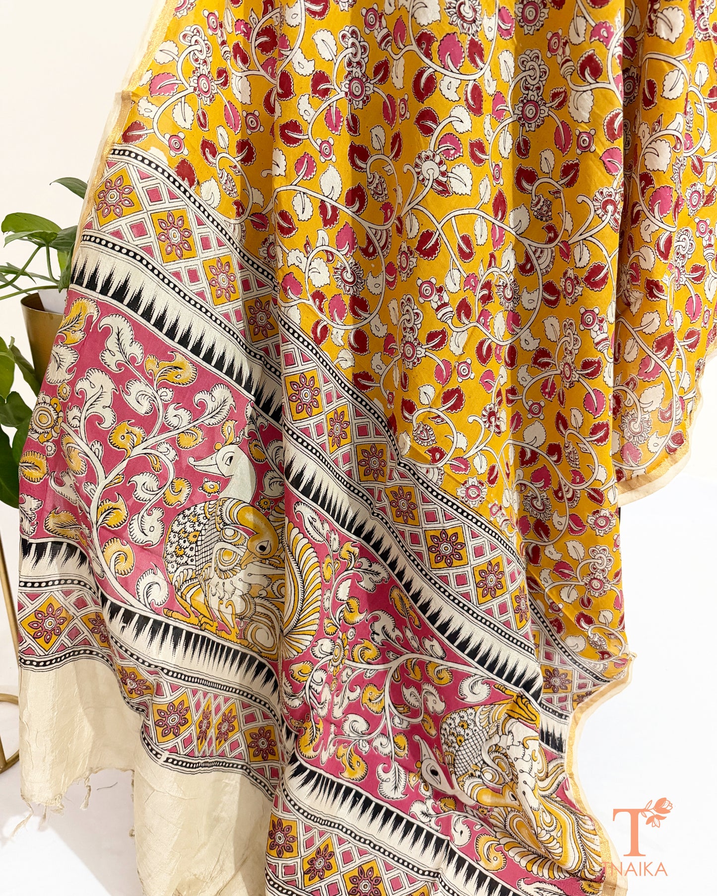 Premium Nellore silk blend hand block Kalamkari dupatta featuring traditional artisan prints, fine zari border and tassel finish.