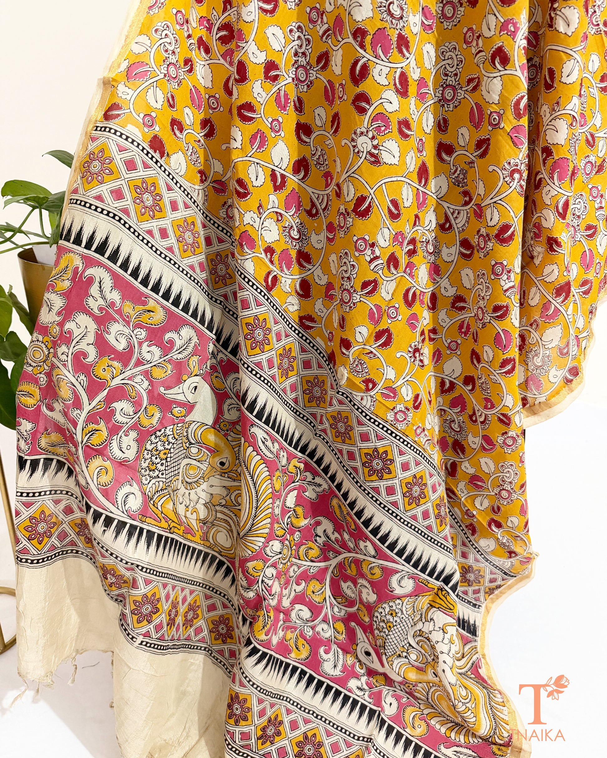 Premium Nellore silk blend hand block Kalamkari dupatta featuring traditional artisan prints, fine zari border and tassel finish.