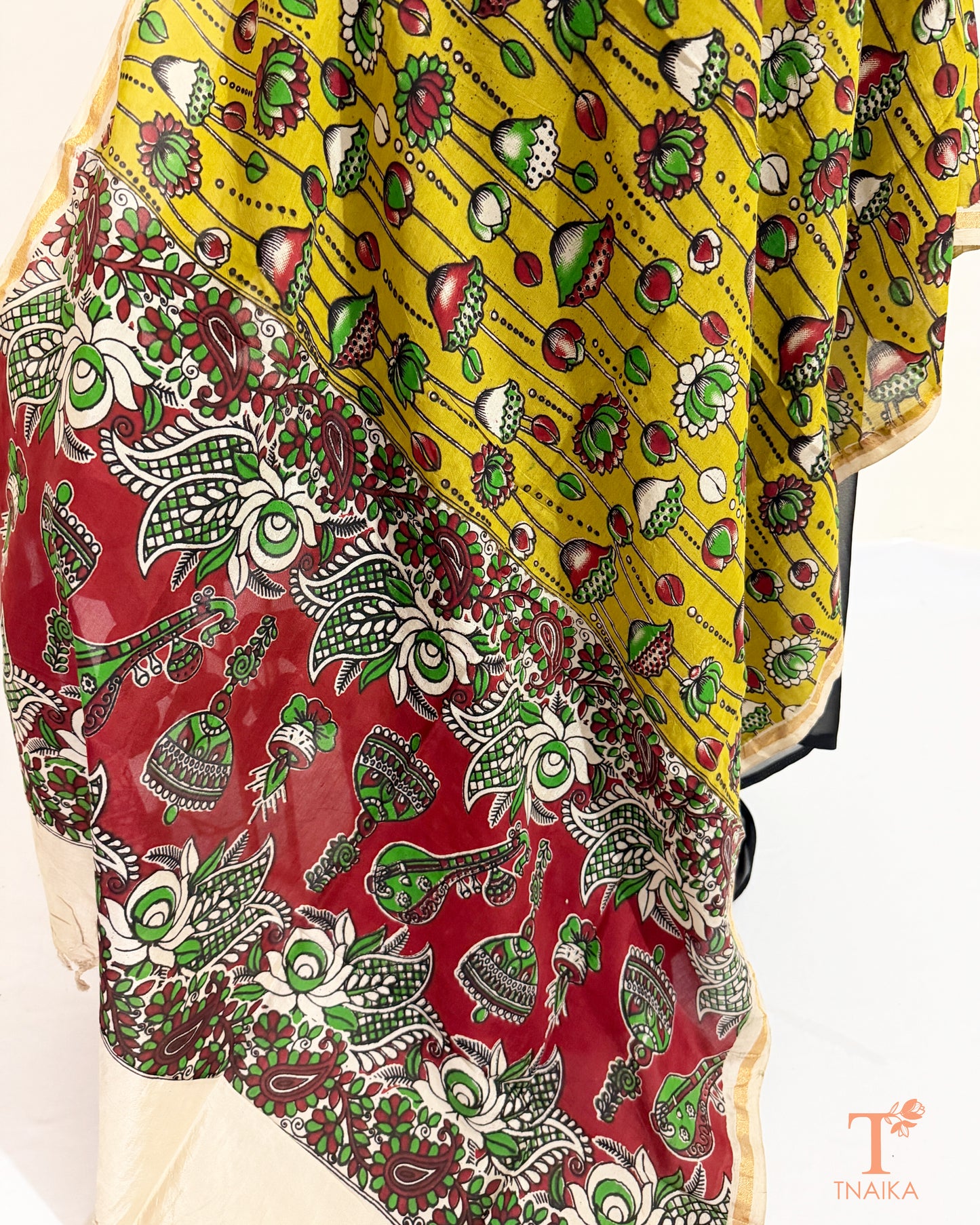 Hand block Kalamkari Nellore silk blend dupatta with fine zari border, traditional artisan prints and soft tassel detailing.