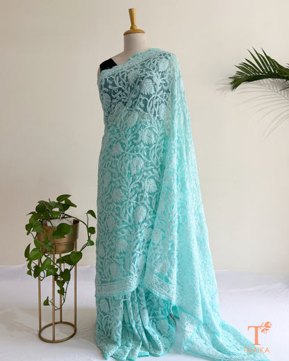 Soft aqua blue Chikankari embroidered saree with intricate floral threadwork