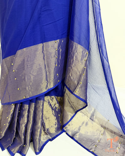 Lightweight chiffon saree with sheer pallu and tissue border.