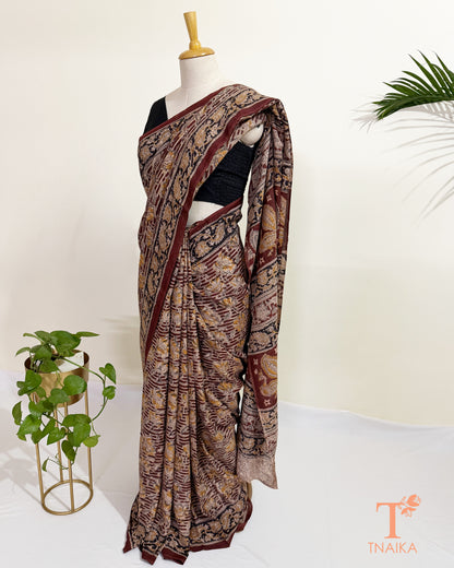 Silk blend hand blocked Kalamkari saree with classic floral and nature-inspired motifs.