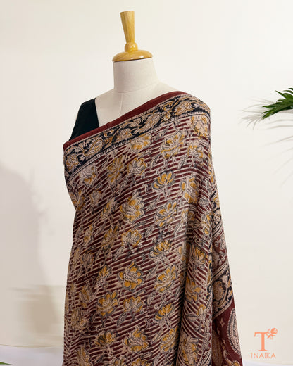 Traditional hand block printed Kalamkari saree showcasing handcrafted artistic designs.