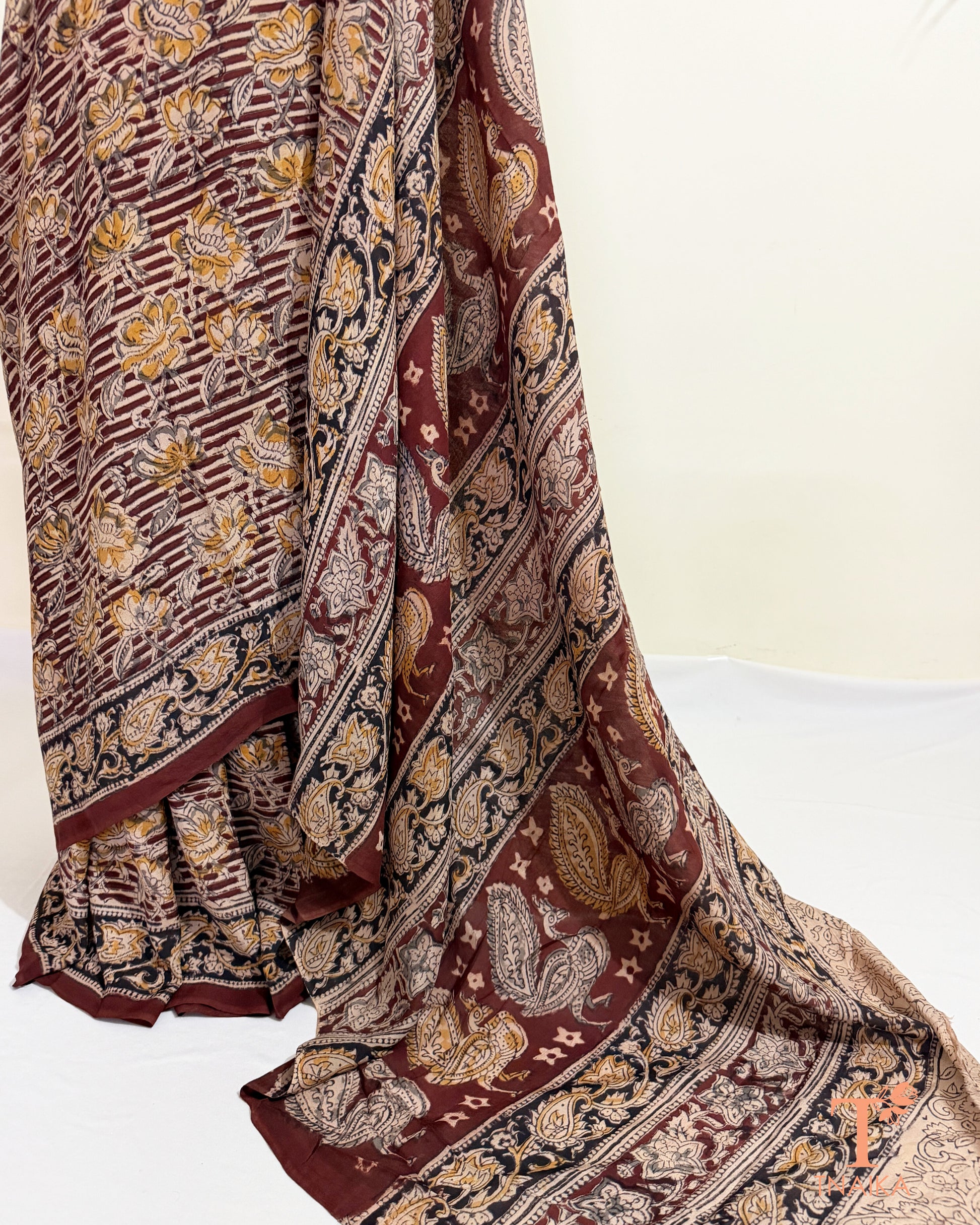 Authentic hand blocked Kalamkari saree with intricate traditional Indian artwork.