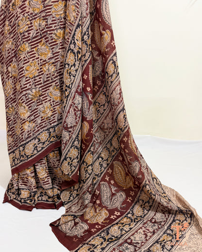 Authentic hand blocked Kalamkari saree with intricate traditional Indian artwork.