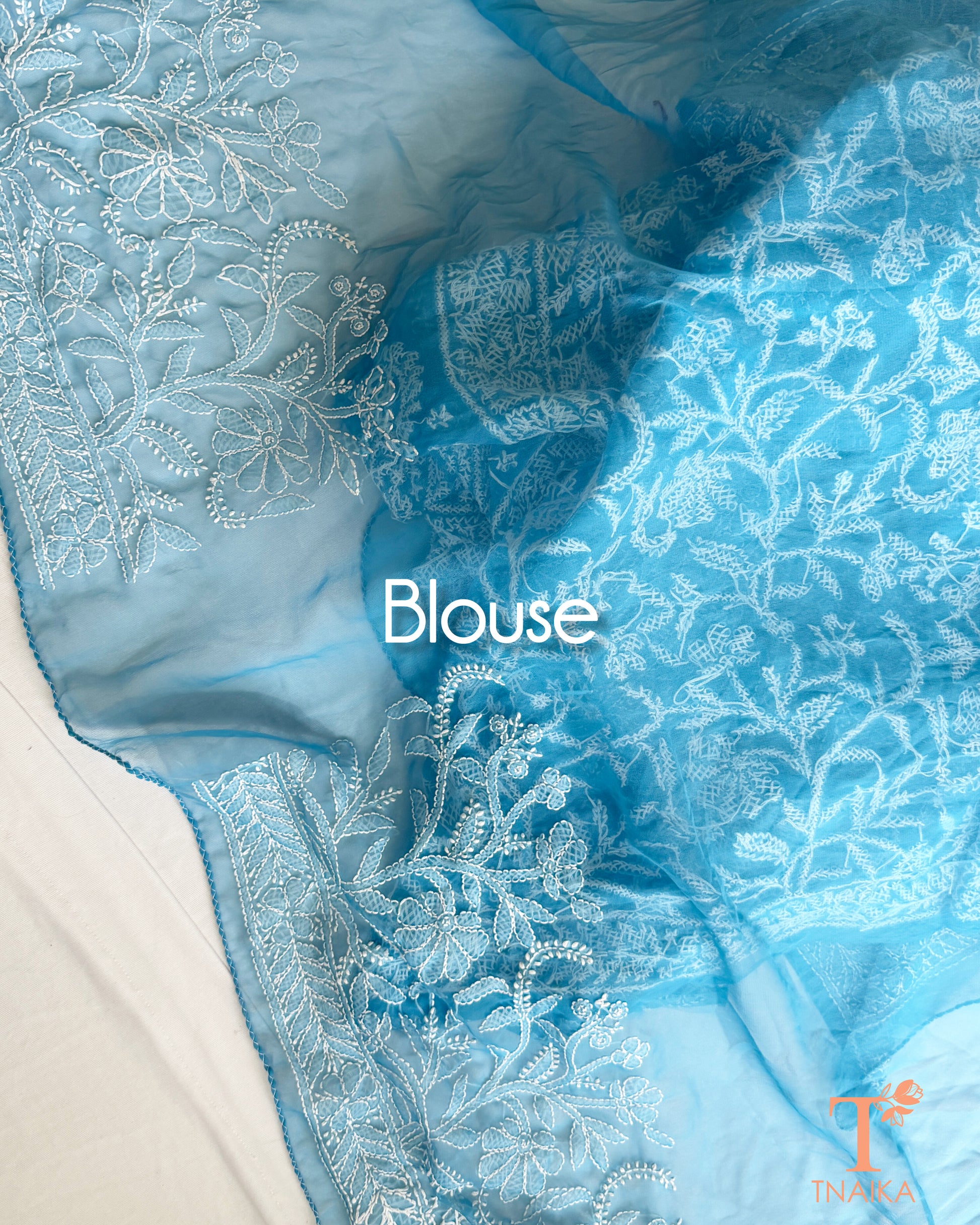 Floral and paisley embroidered powder blue Chikankari saree with running blouse for festive and occasion wear.