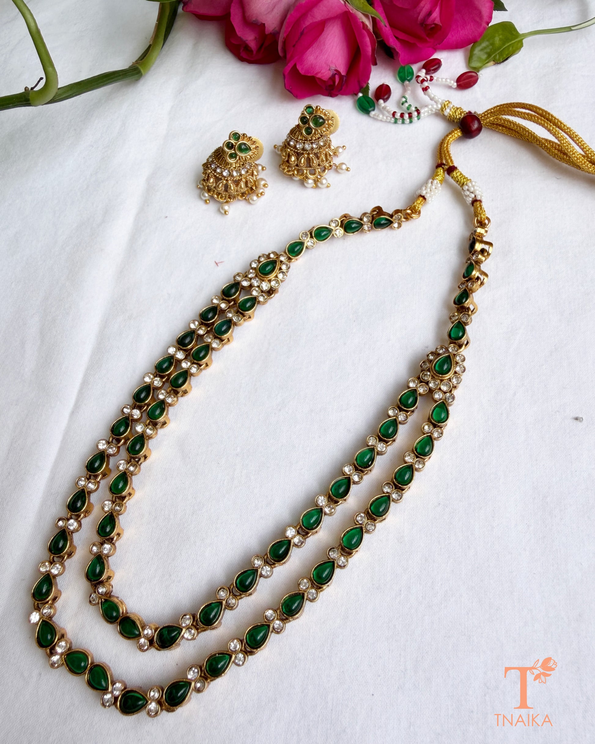 Emerald green artificial stone necklace set with matching pearl jhumki earrings.