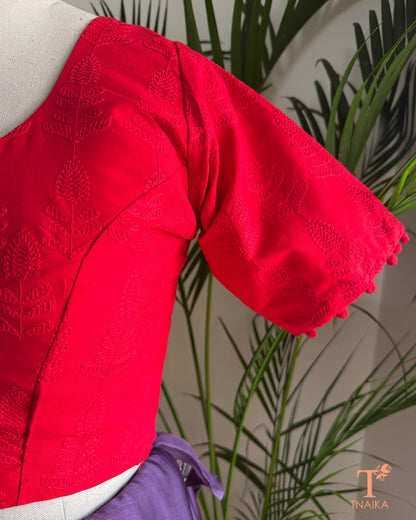 Red Chikankari embroidered blouse with tonal floral machine embroidery and potli button sleeves.