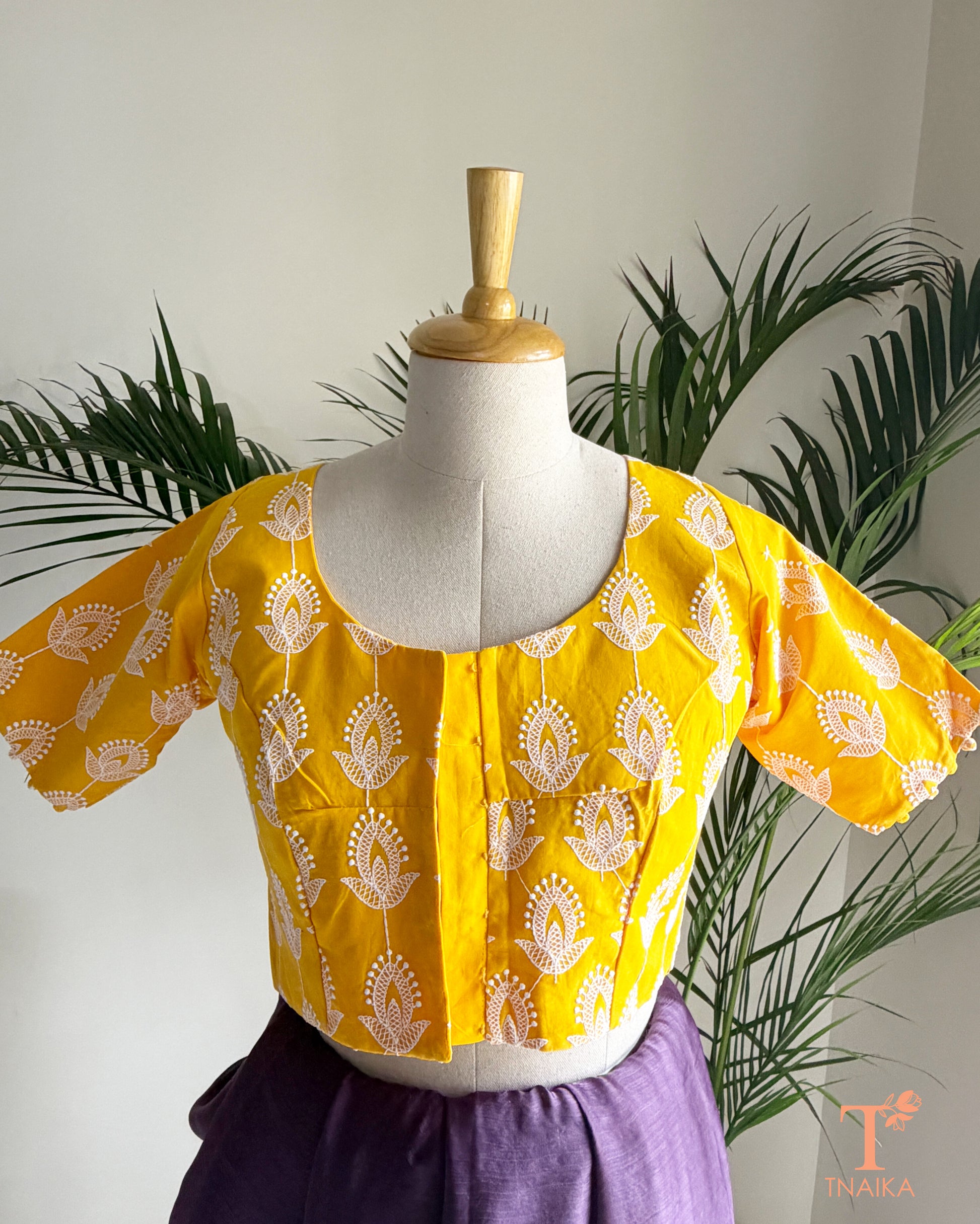 Women's ethnic blouse with fine machine embroidery and classic Chikankari motifs.
