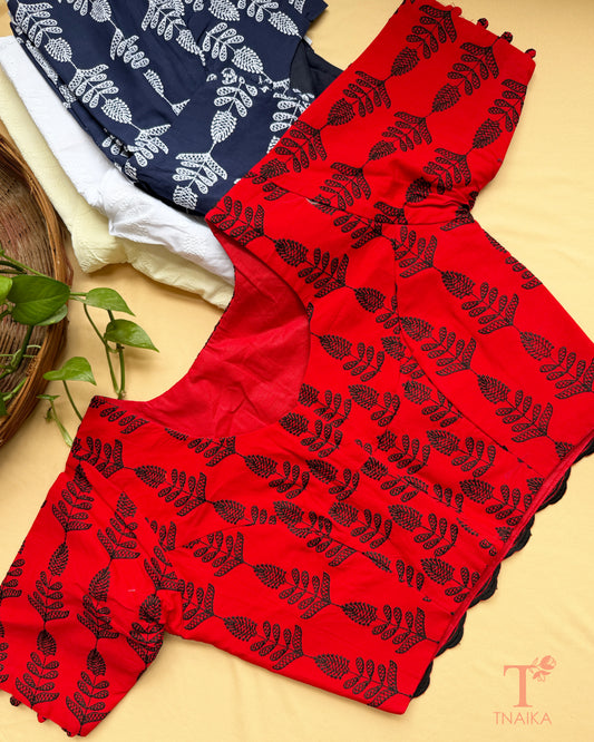 Designer Chikankari blouse featuring tonal floral embroidery and elbow sleeves.