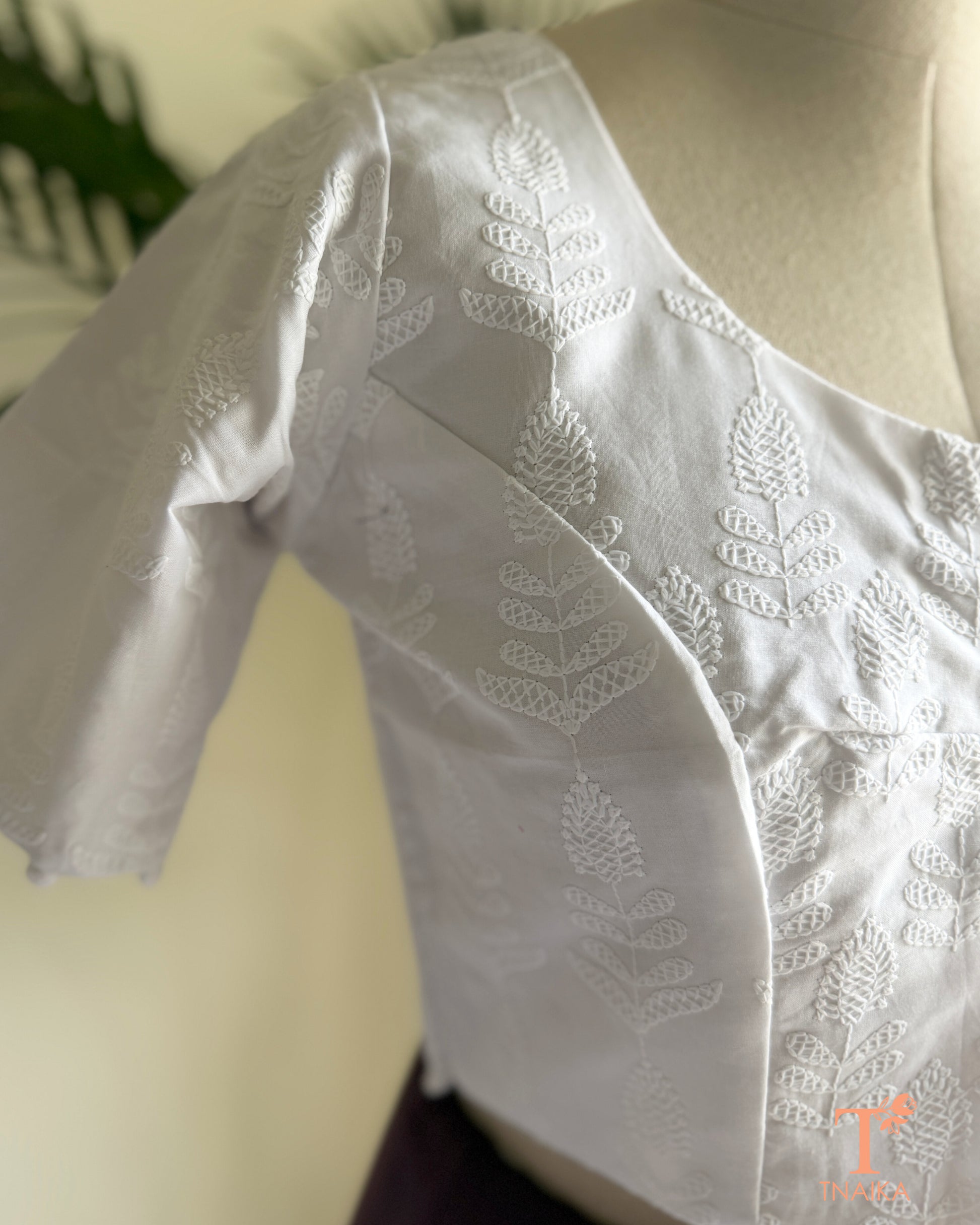 Traditional machine embroidered blouse with intricate floral Chikankari detailing.