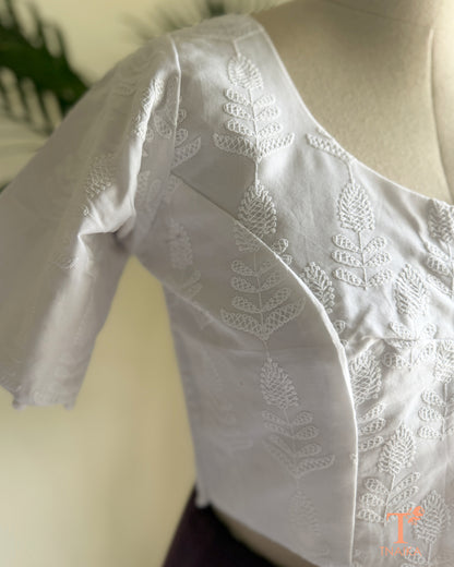 Traditional machine embroidered blouse with intricate floral Chikankari detailing.