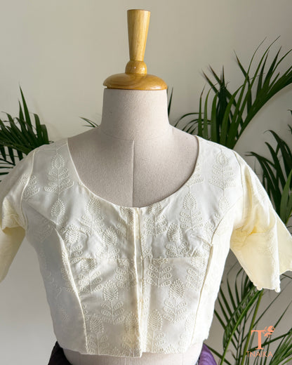 Chikankari-inspired machine embroidered blouse with timeless floral craftsmanship.