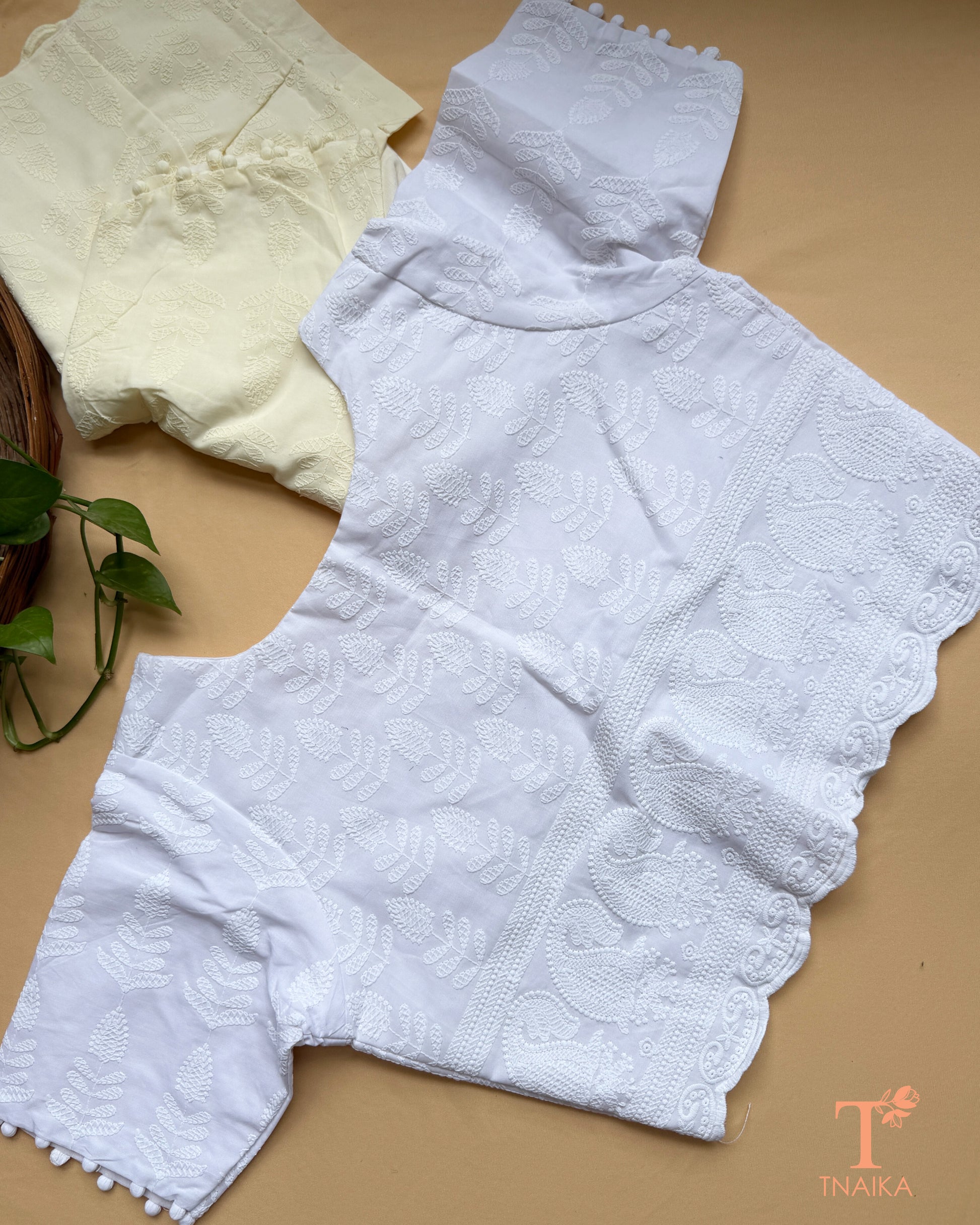 Women's ethnic blouse with fine machine embroidery and classic Chikankari motifs.