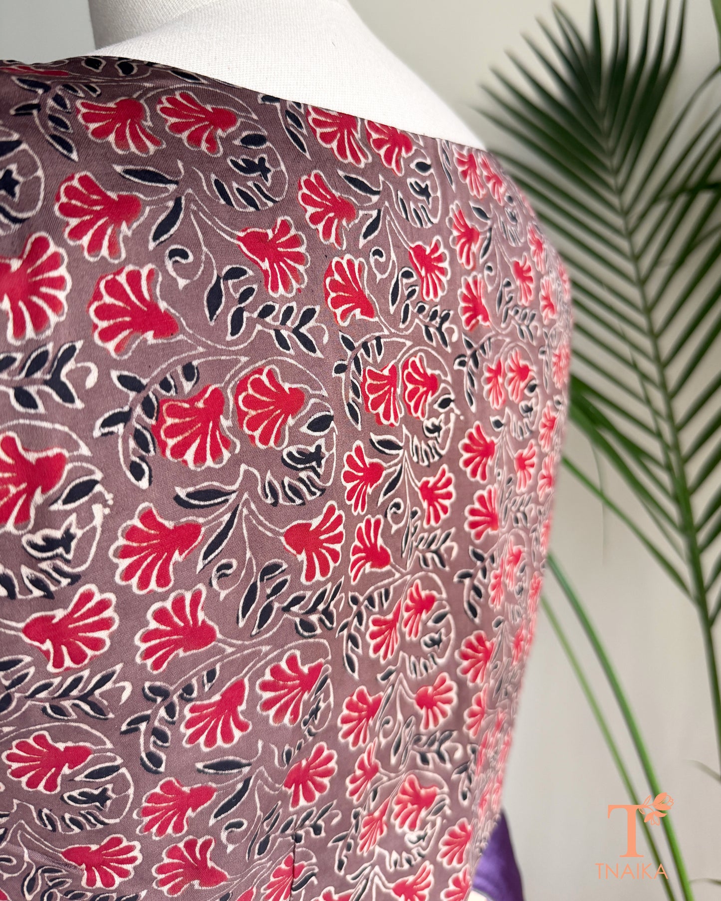 Modal silk blouse with floral hand block print and half sleeves.
