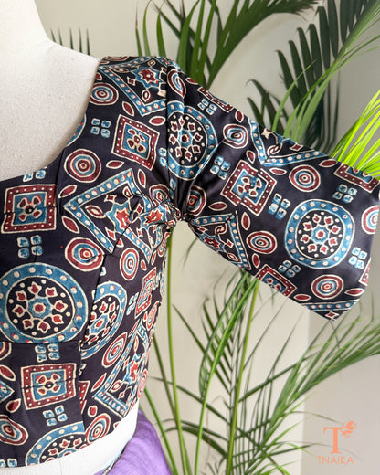 Close-up of hand block print modal silk blouse sleeve showing artisan-inspired motifs.