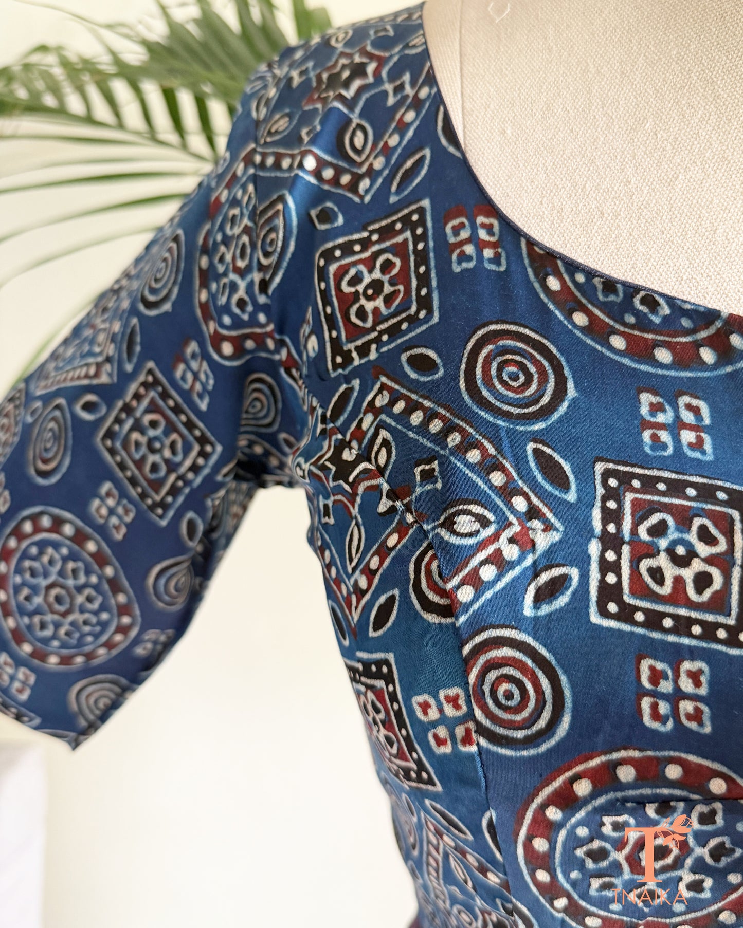 Blue modal silk blouse with heritage geometric hand block print and round neckline.