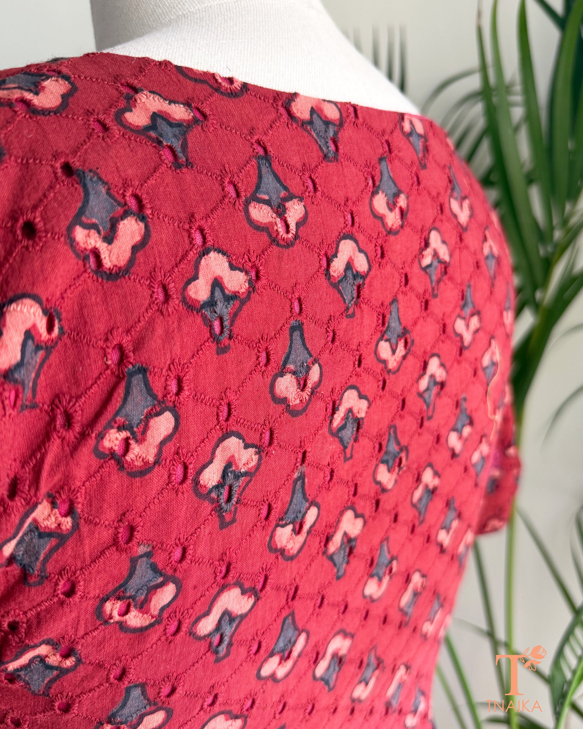 Hakoba cotton blouse with Ajrakh hand block print, eyelet embroidery and V-notch neckline.